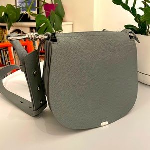 AllSaints Captain Leather Lea Round Crossbody Bag in Denim Blue.